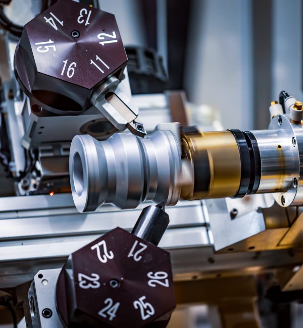 Metalworking CNC milling machine. Cutting metal modern processing technology. Small depth of field. Warning - authentic shooting in challenging conditions. A little bit grain and maybe blurred.